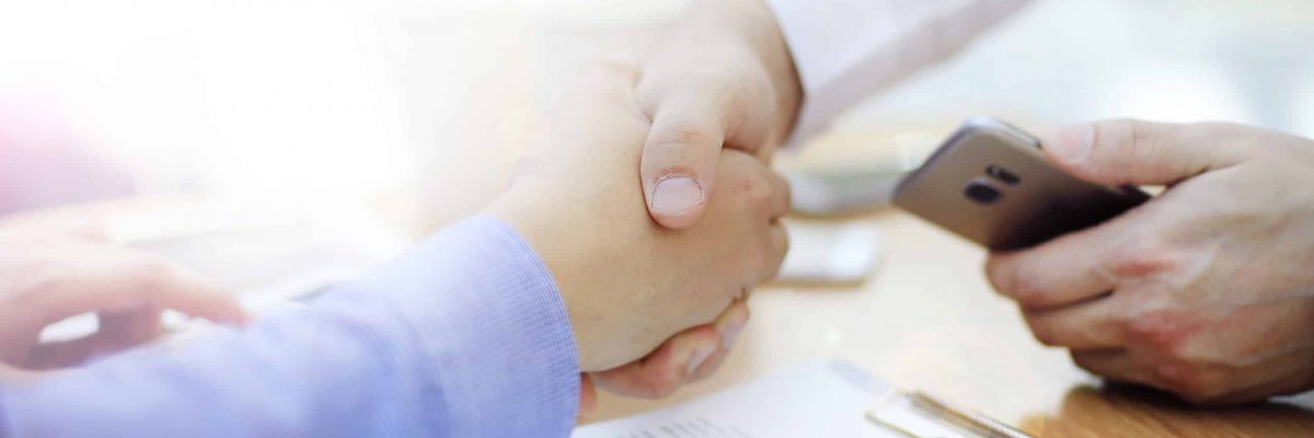 business man handshake business man handshake in modern office after good deal